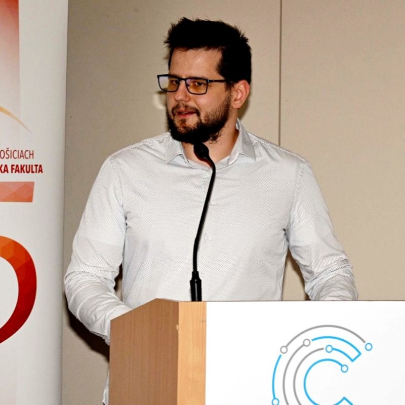 Dr. Matej Gazda speaking at a conference